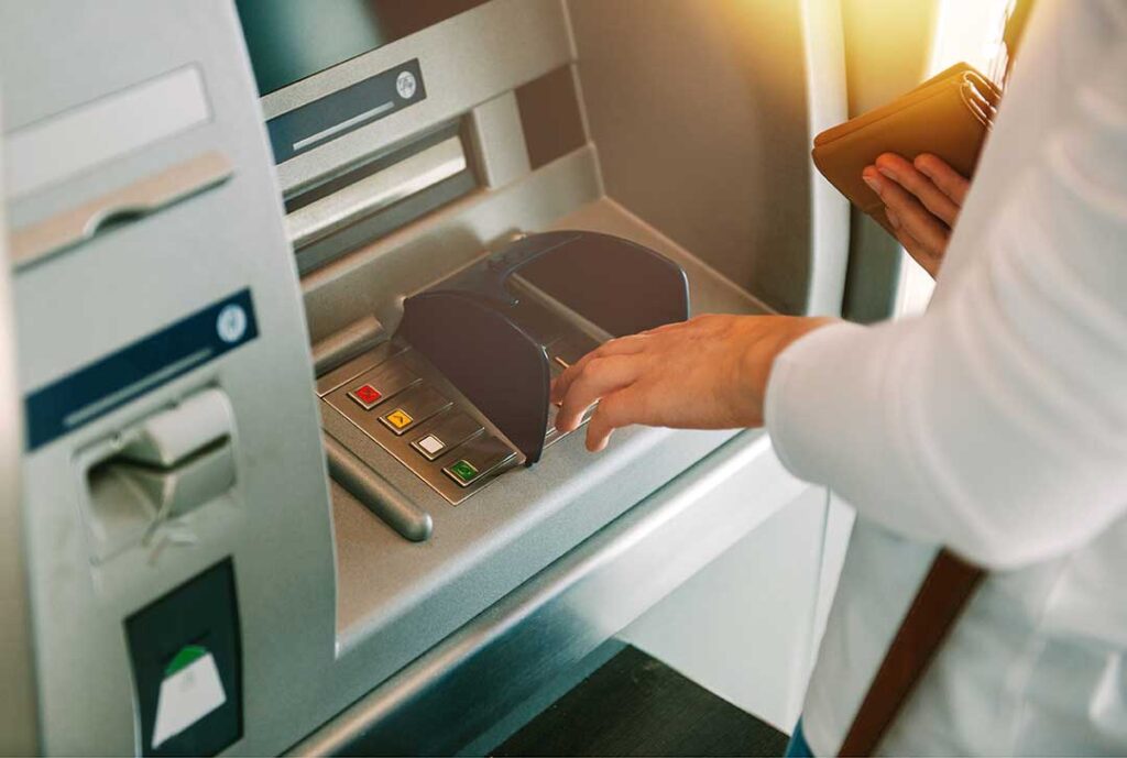 A family checking their grocery list while shopping for fresh produce in a supermarket aisle.
